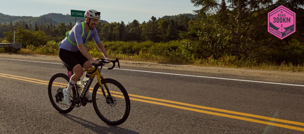 Andreas riding his bike leaving St-Côme during the 2025 race across Quebec.